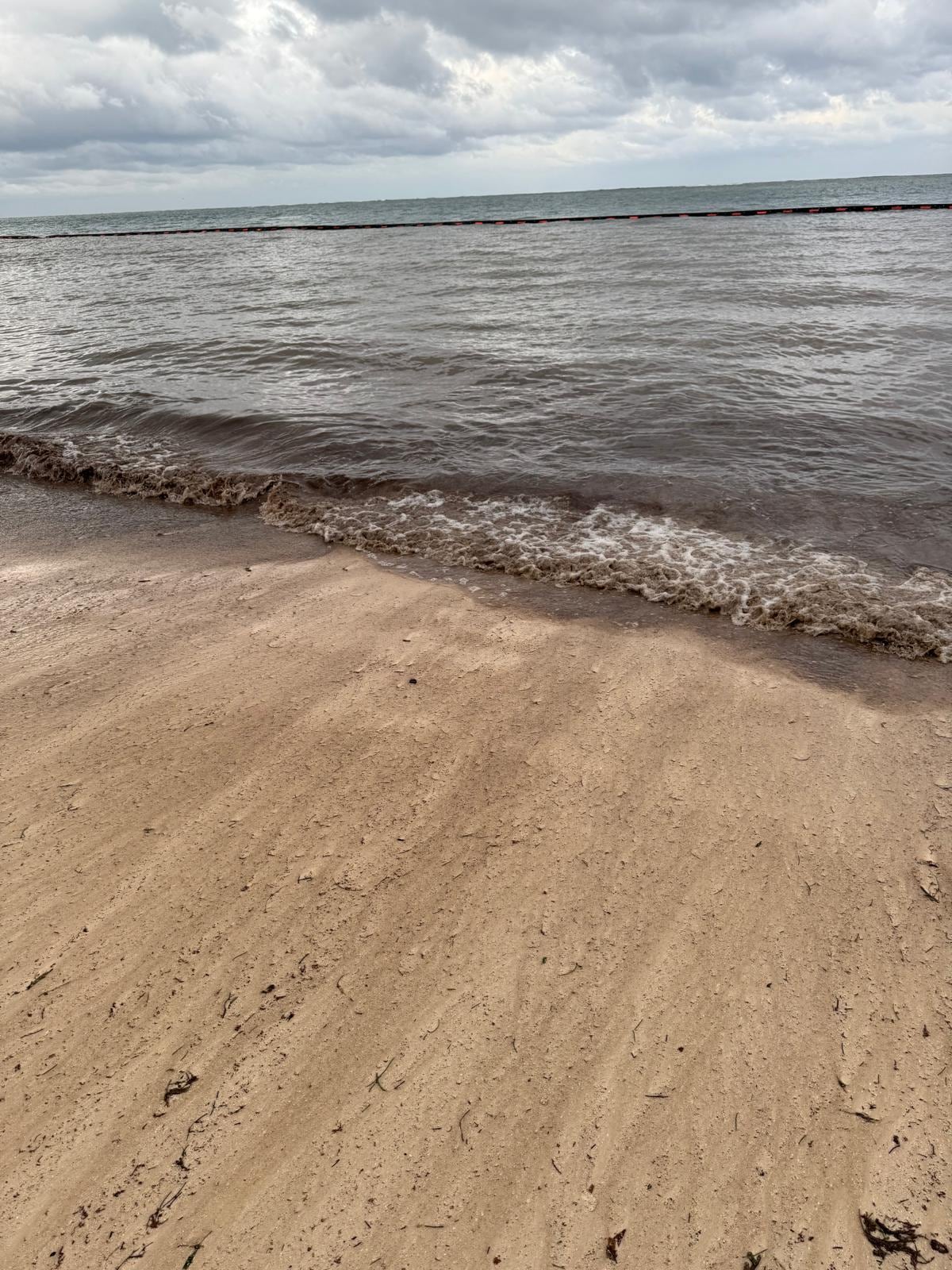 The water is boiling seaweed and trash. You can even see that the water behind the net is cleaner