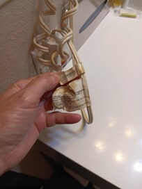 Cord and warning tags from same hair dryer. Yuck on nice clothes!