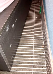 Trash and debris under bed