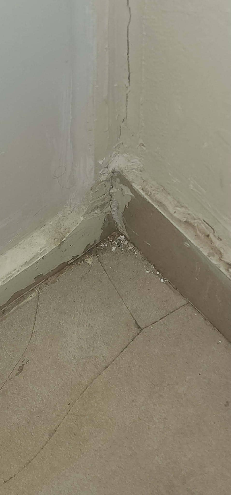 Cracked tiles in the bathroom.