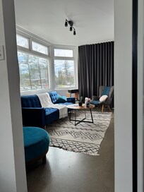 Massive windows in the lounge room- views of greenmount beach. Also a record player in the corner was a fun touch ! Plenty of records to choose from too!