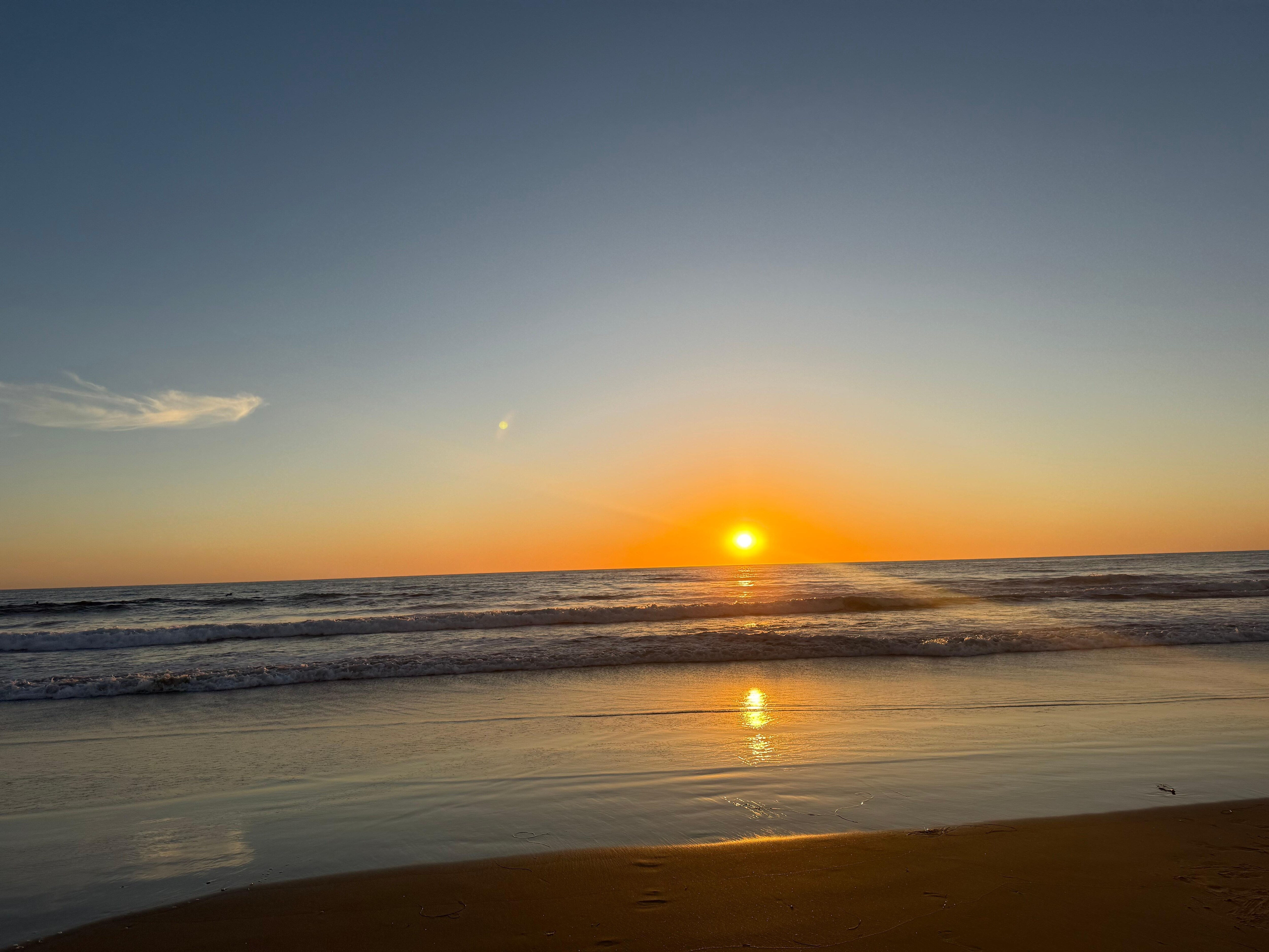 Sunset from the beach right outside the rental!