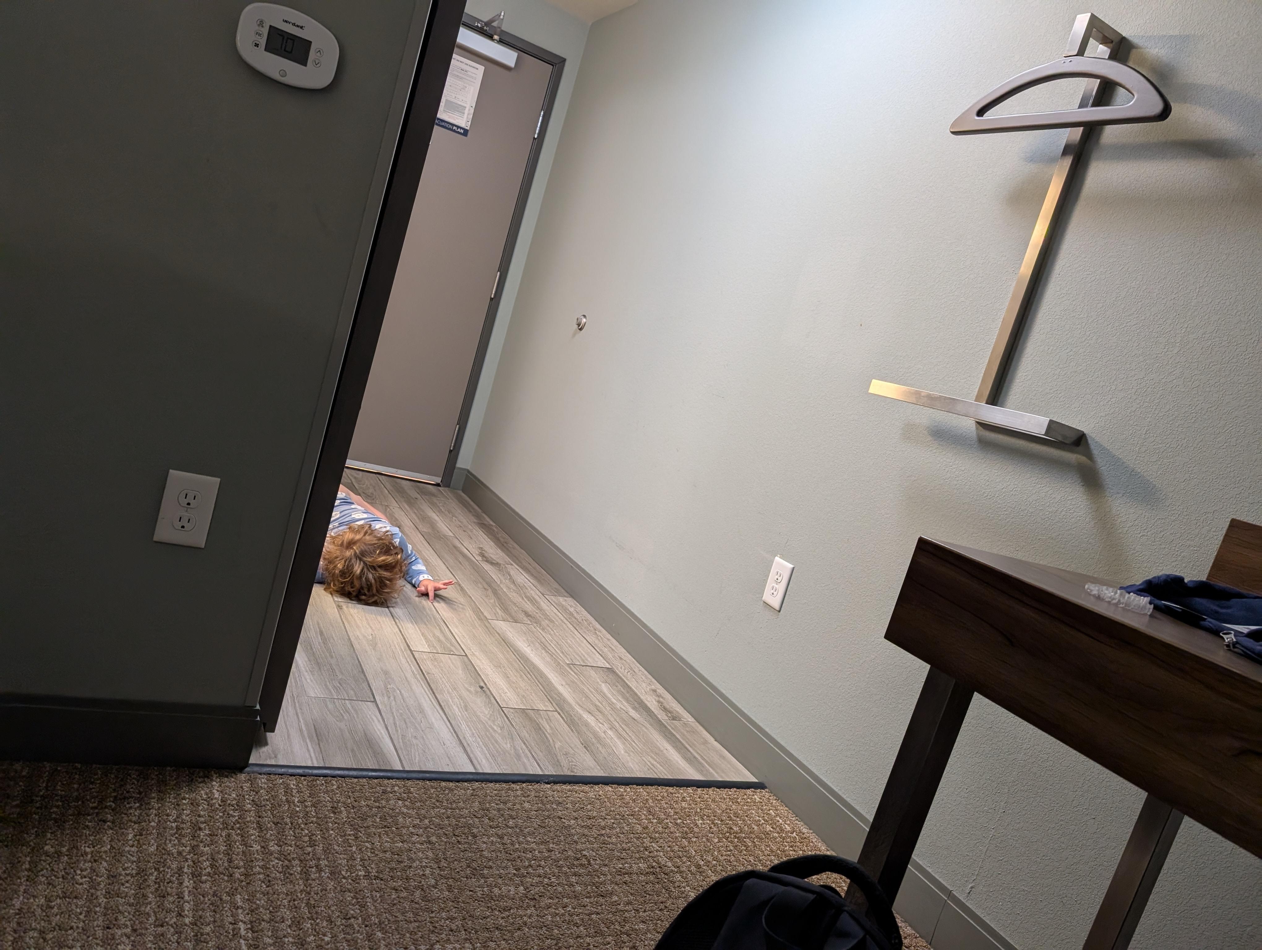Toddler loves the pool so much that he lays on the ground by our door until it opens.