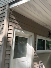 Webs and spiders all over front porch