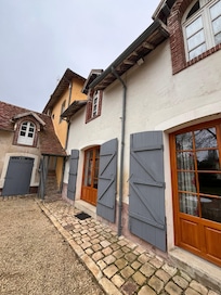 The view walking into the courtyard up to the front door of our rental. Very cute!