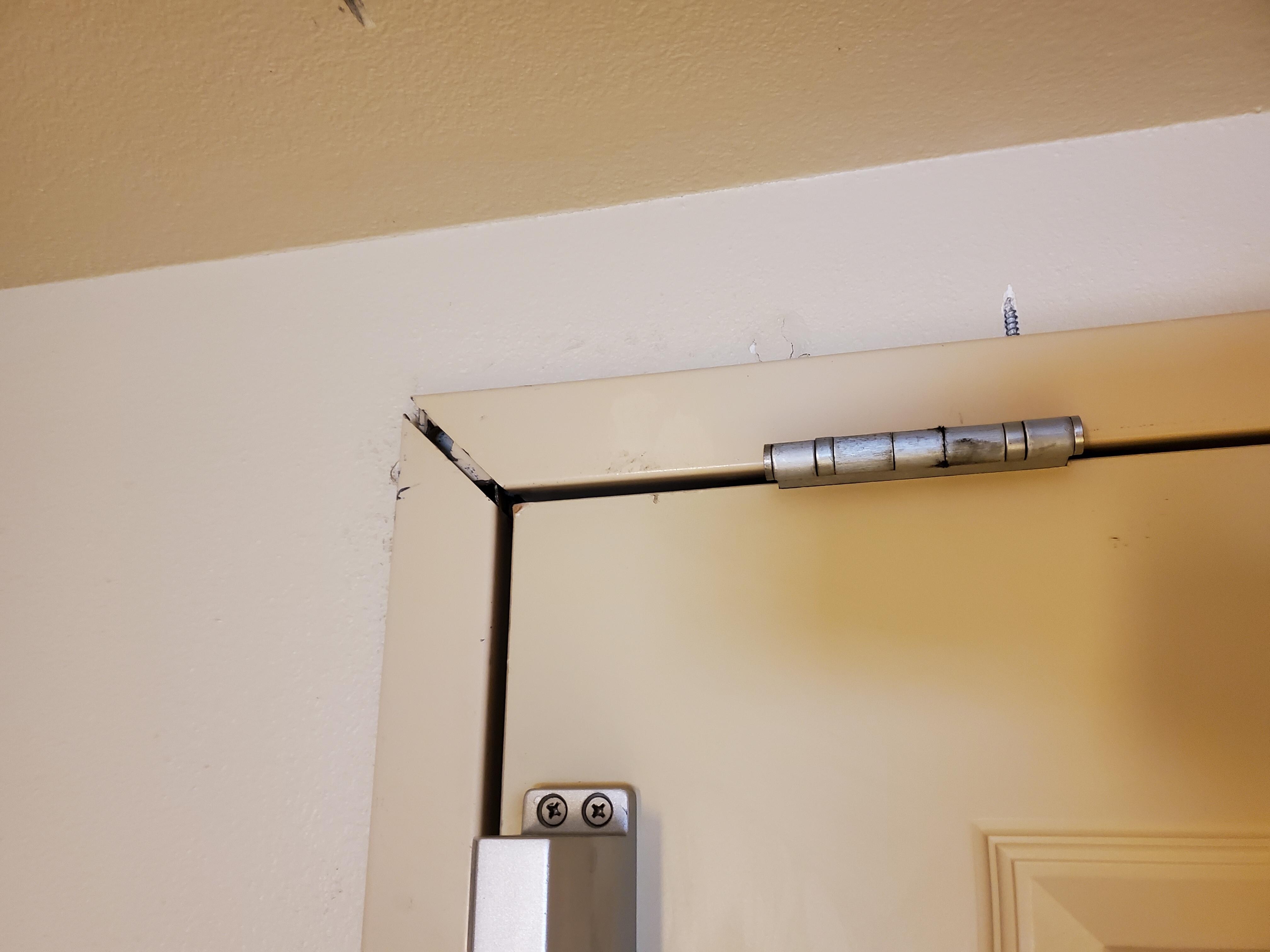 Poorly aligned metal door frame