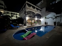 Night view from one sitting area back to house