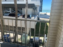 Crane your neck and look across the trash cans past the high rise building that really IS beachfront and you can see part of a beach. And this is advertised as a "Beachfront Penthouse"