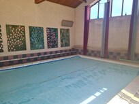 Heated pool with Ruth's artwork displayed