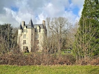 Outside the castle. She stands tall and strong