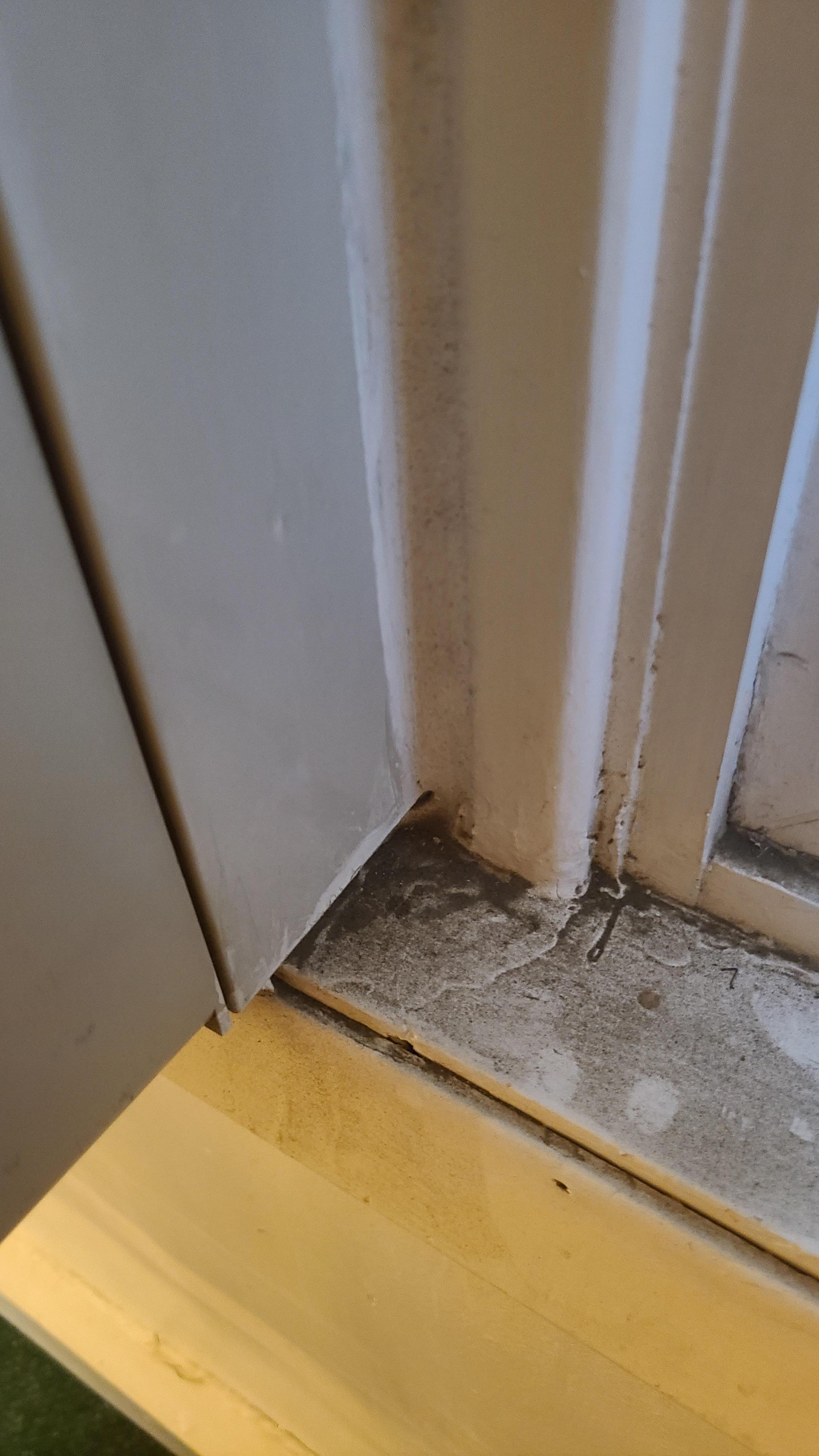 Thick black dirt on window sills.