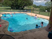 Pool with steps at both ends and a volleyball net