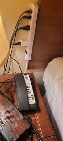 Power bar attached to the side of the bed
