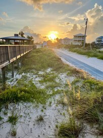 View from the beach look toward the house and sunrise