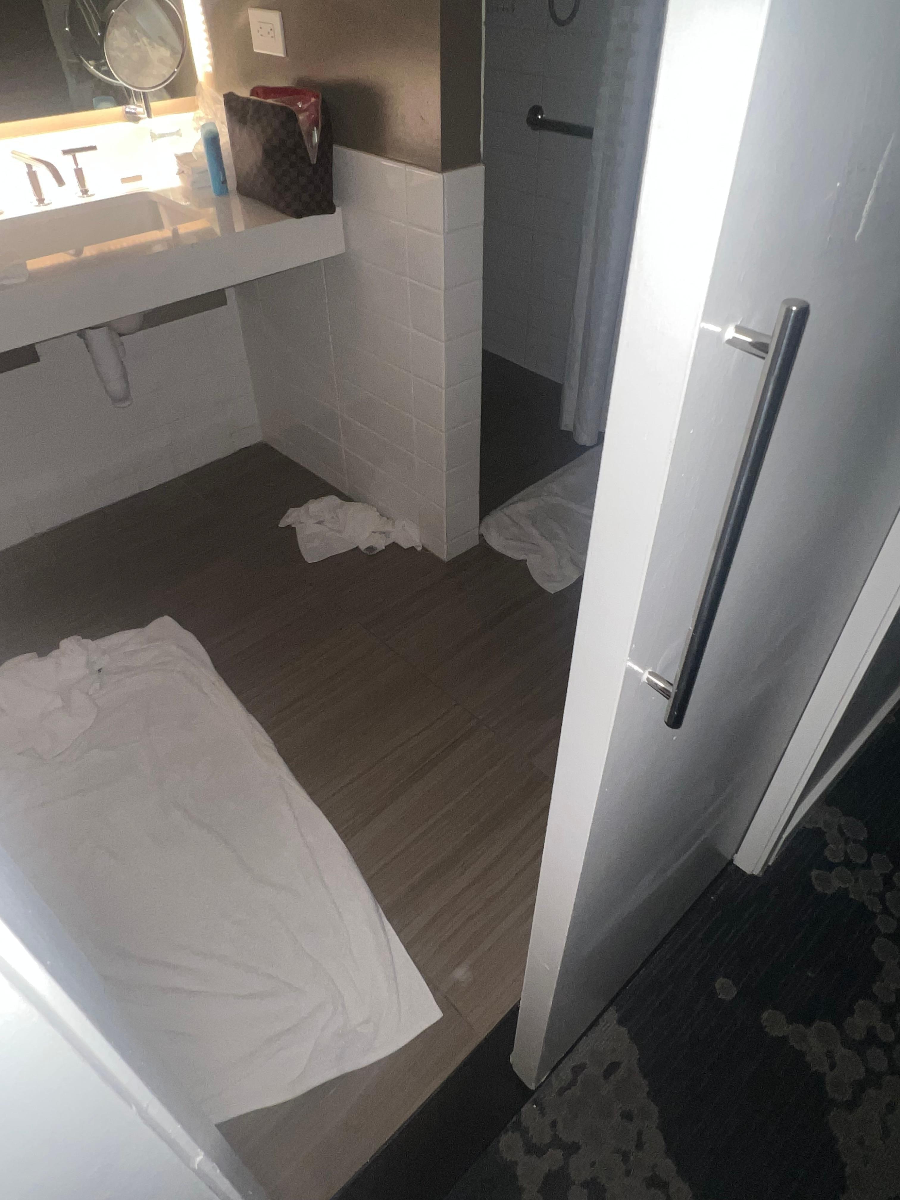 Slanted shower caused water to leak out to the flioor