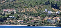 View of Flower Houses and Glyfa Beach from the sea.