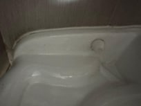 Black hairs all around toilet