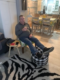 The only chair in the condo with a tiny bean bag for the feet