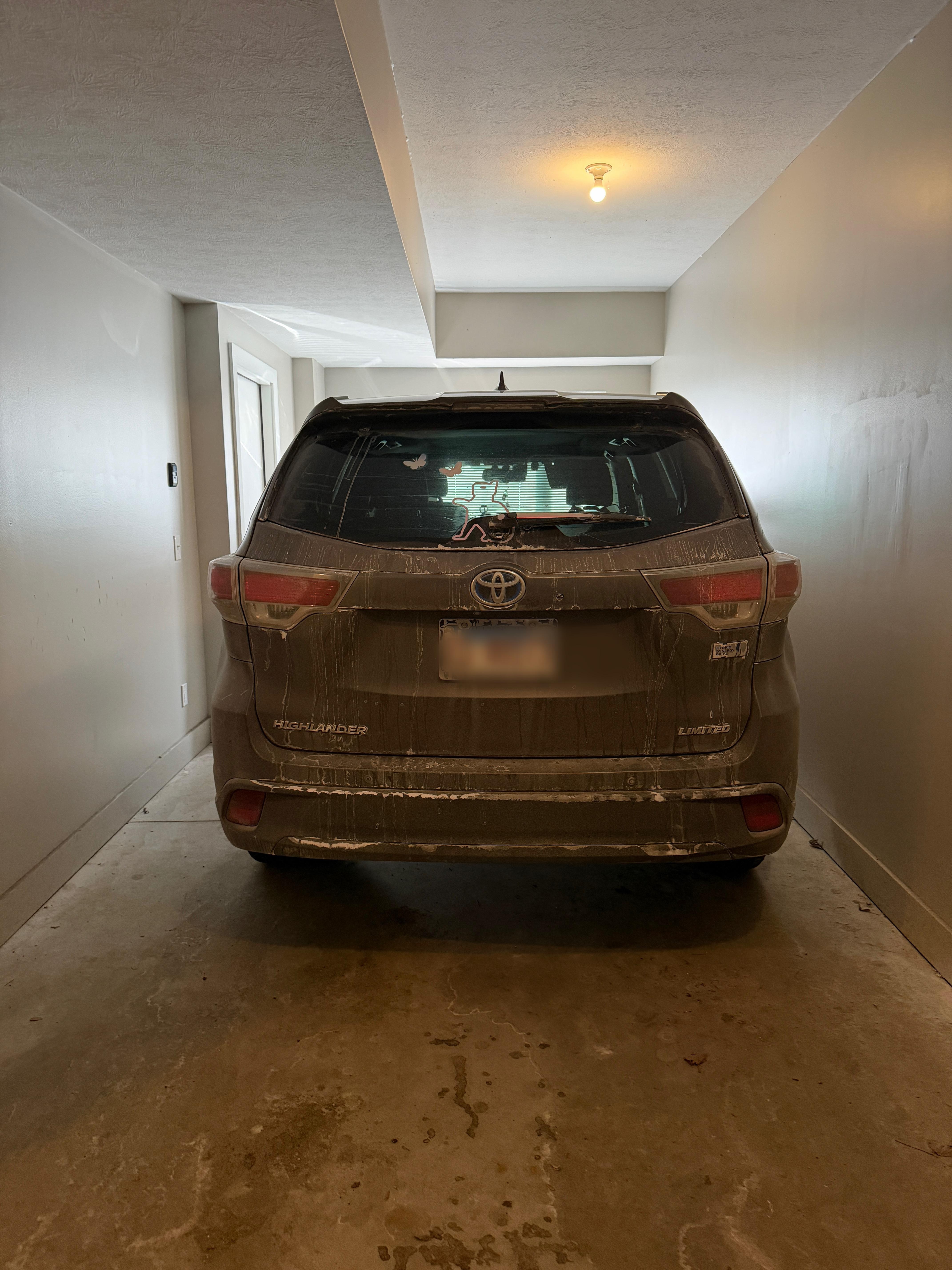 Garage. Long enough for two SMALL cars, but extremely narrow. 