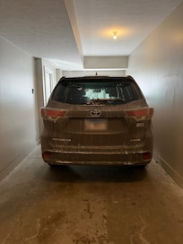 Garage. Long enough for two SMALL cars, but extremely narrow.