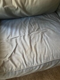 Stained worn out sofa