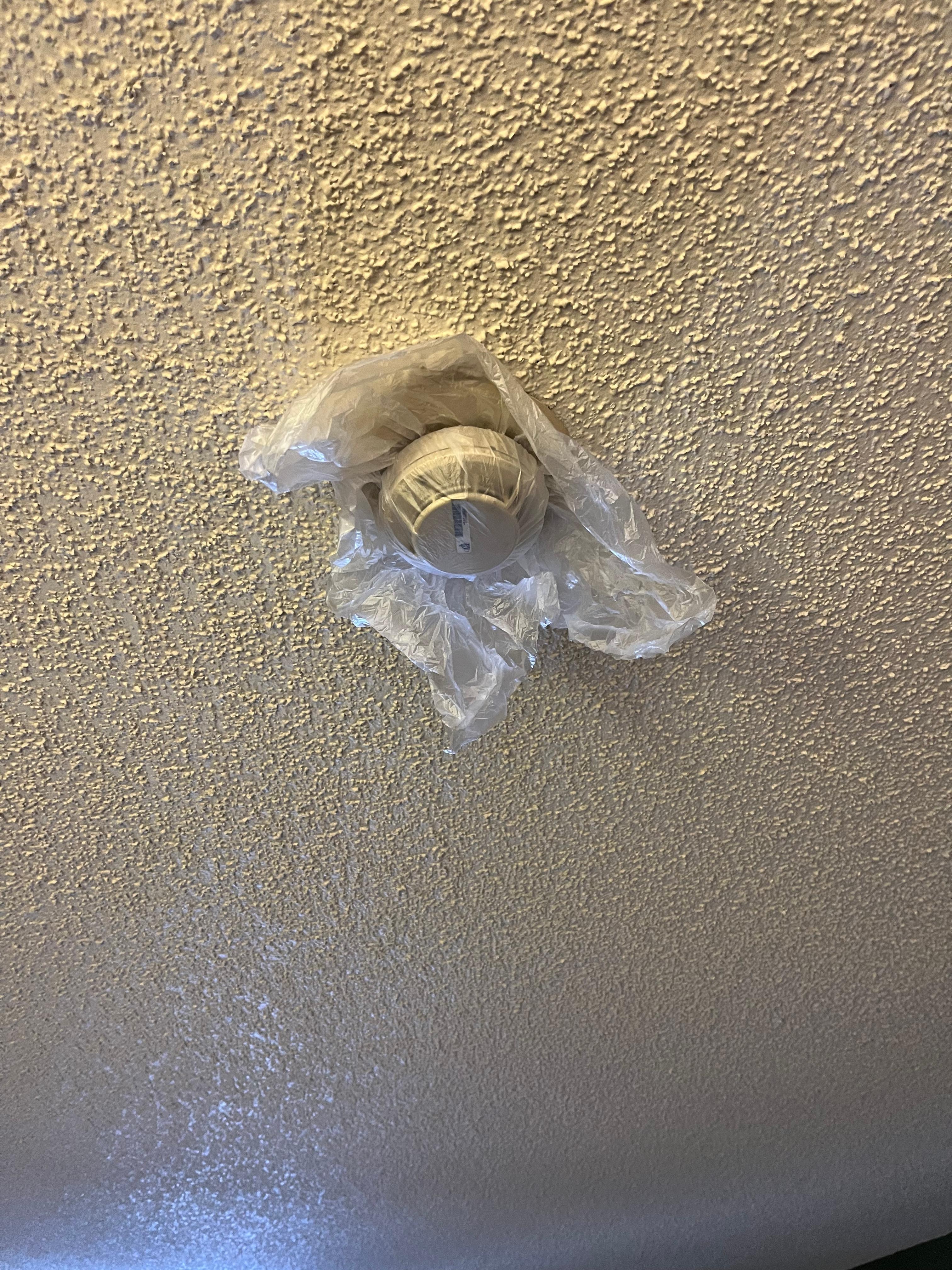 Smoke detector covered with plastic bag