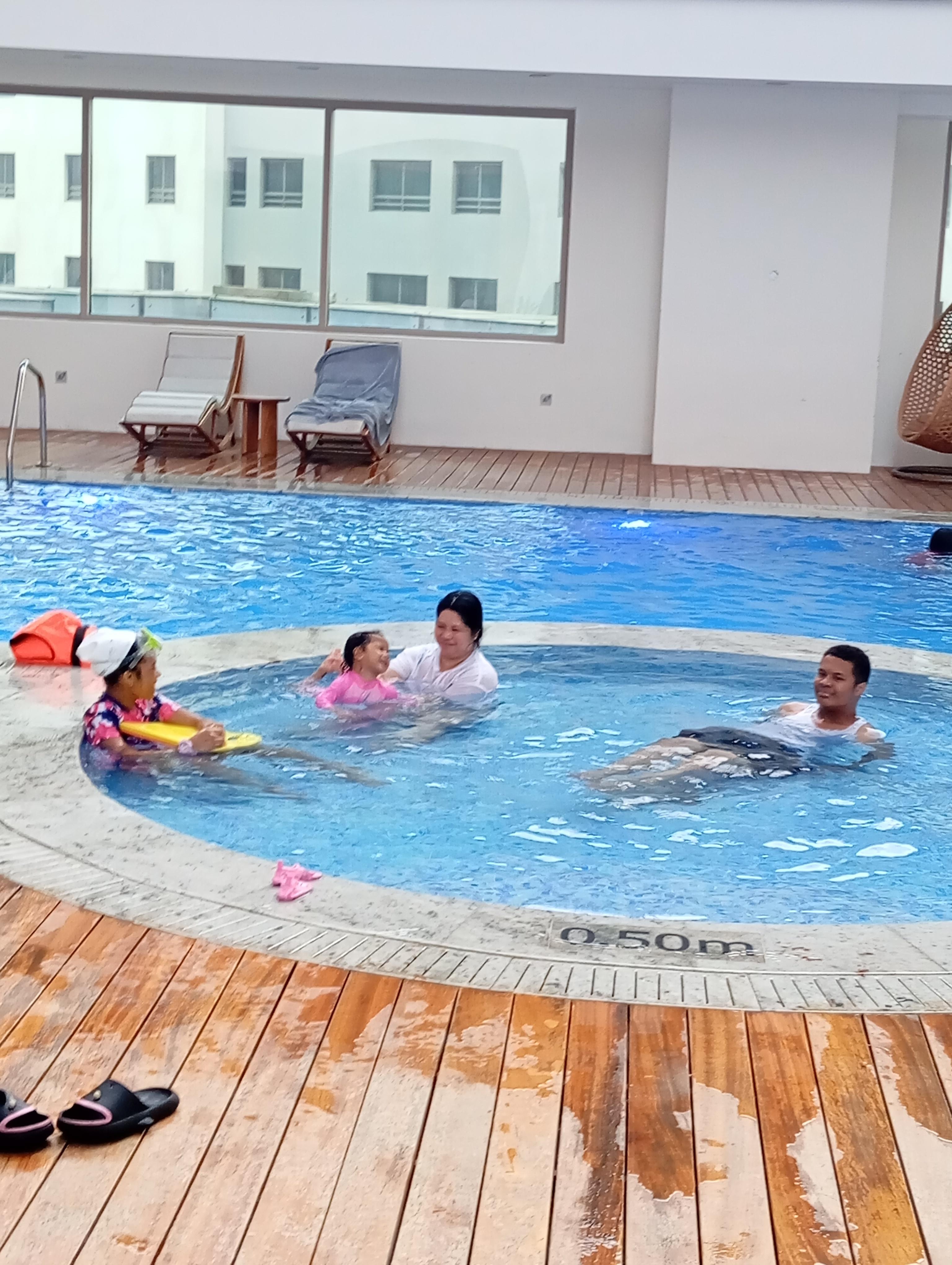 Family Enjoying the Pool