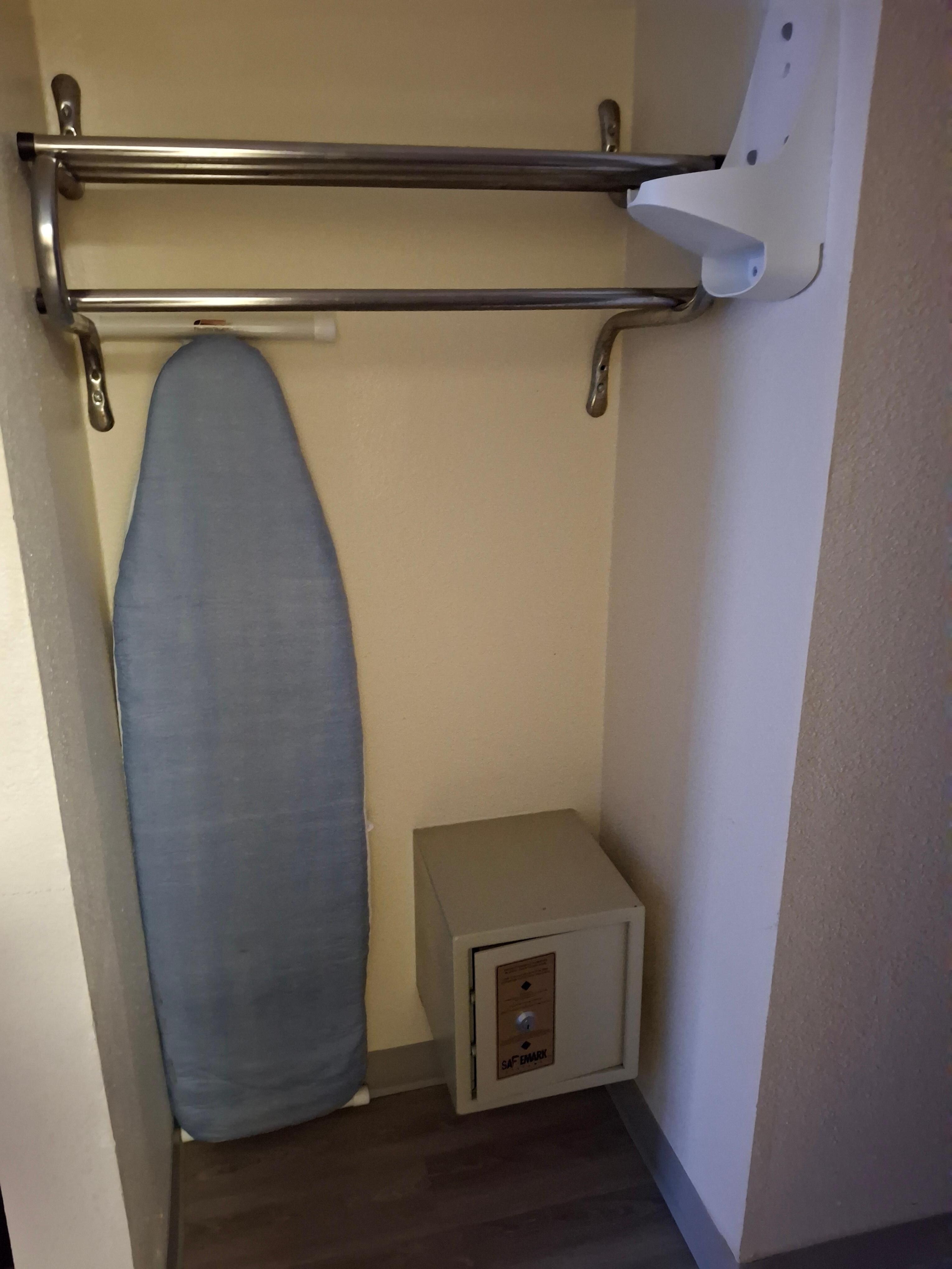 Clothes rack - no hangers. Ironing board - no iron.