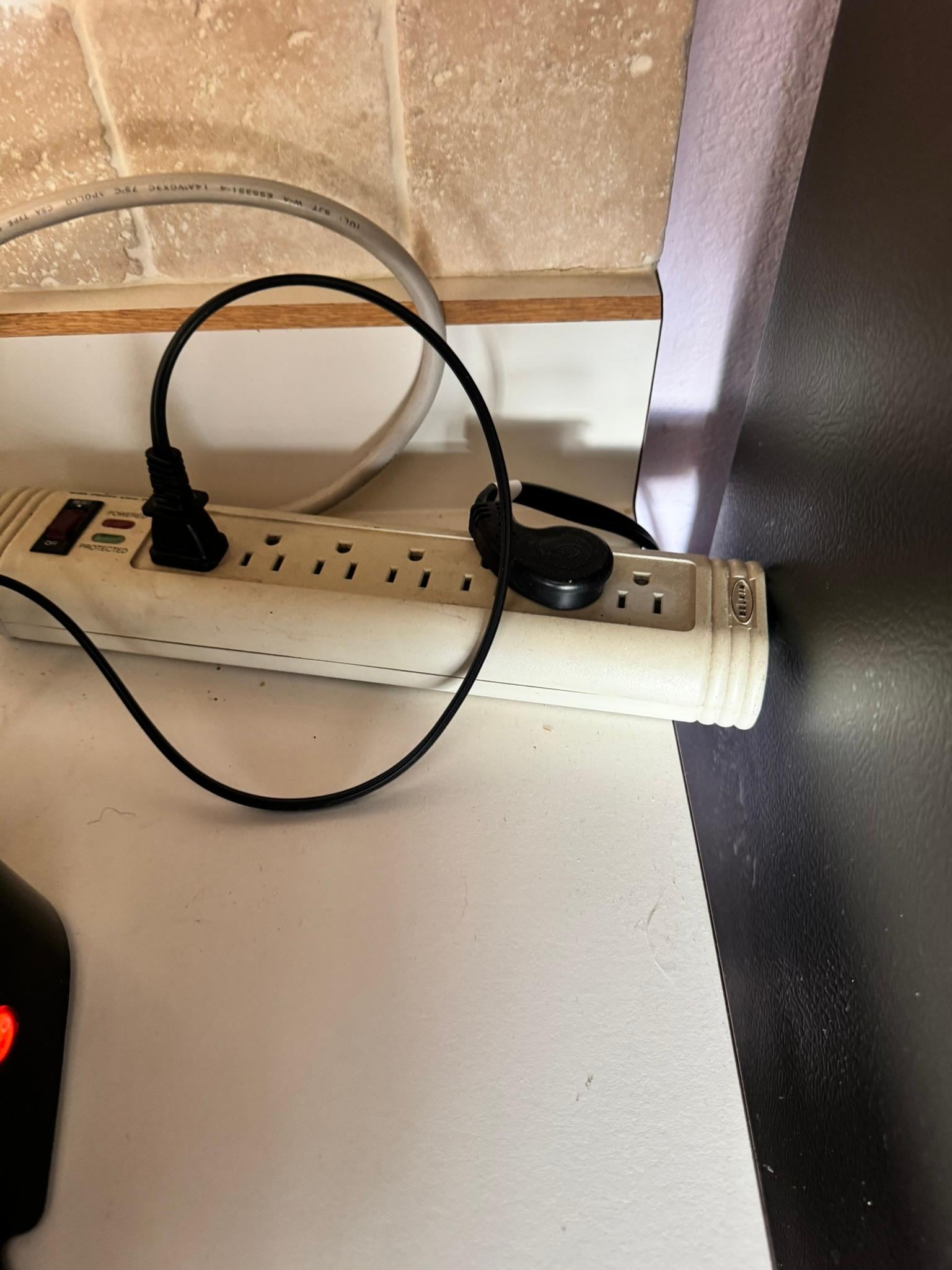 Here's where the for traders been plugged into sitting on the countertop right next to the coffee maker and all the other items