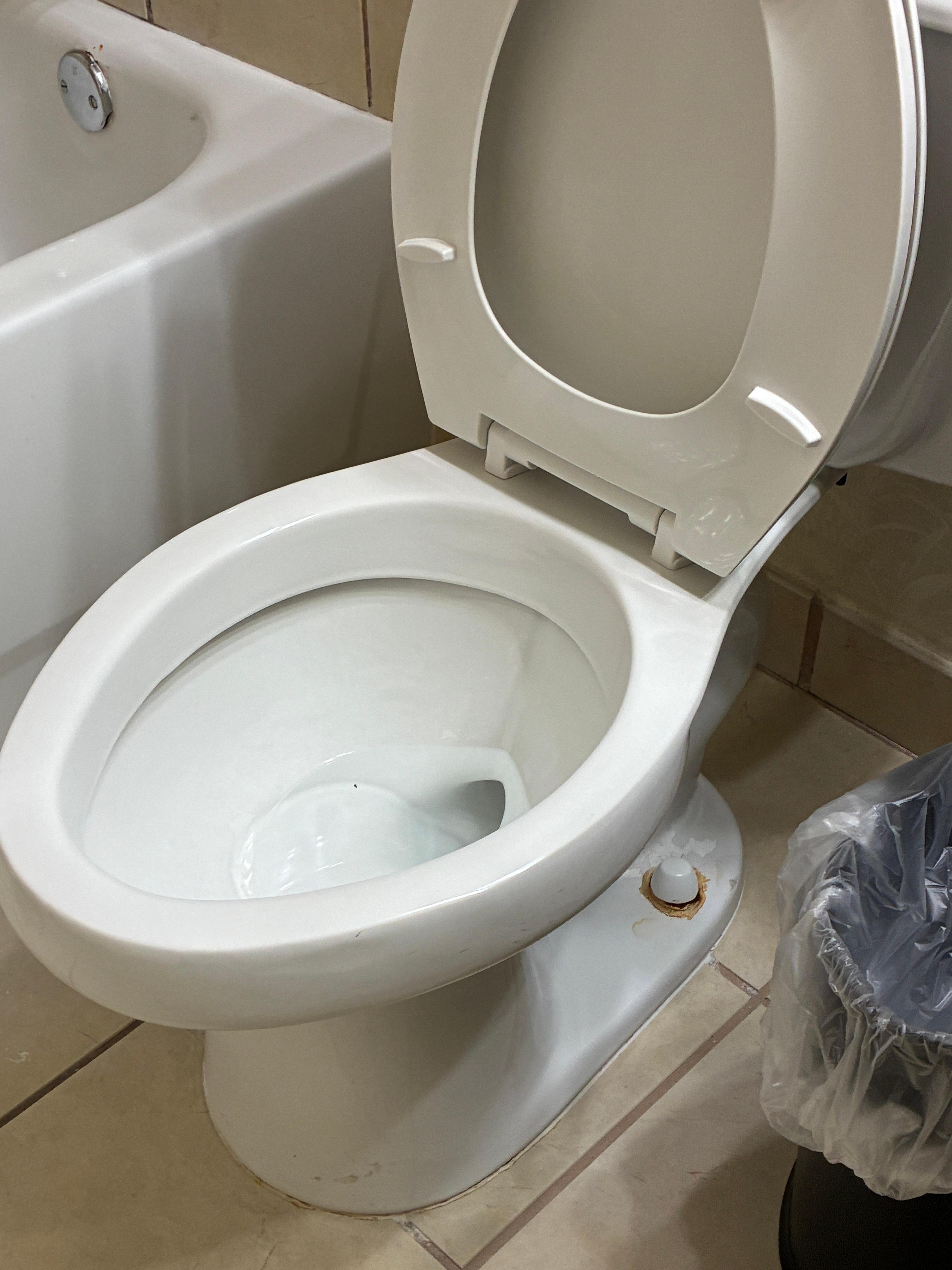 Rusted dirty toilet with black mold