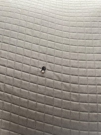 Cigarette hole in bedspread
