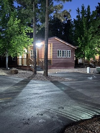 Night shot of our cabin in the pines.