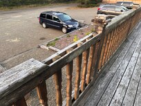 Missing porch railing. Splintered deck surface
3 side fencing- not fenced yard