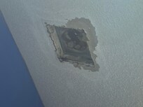 Oh the ceiling in the bathroom. I think they were going for a vent..failed big time