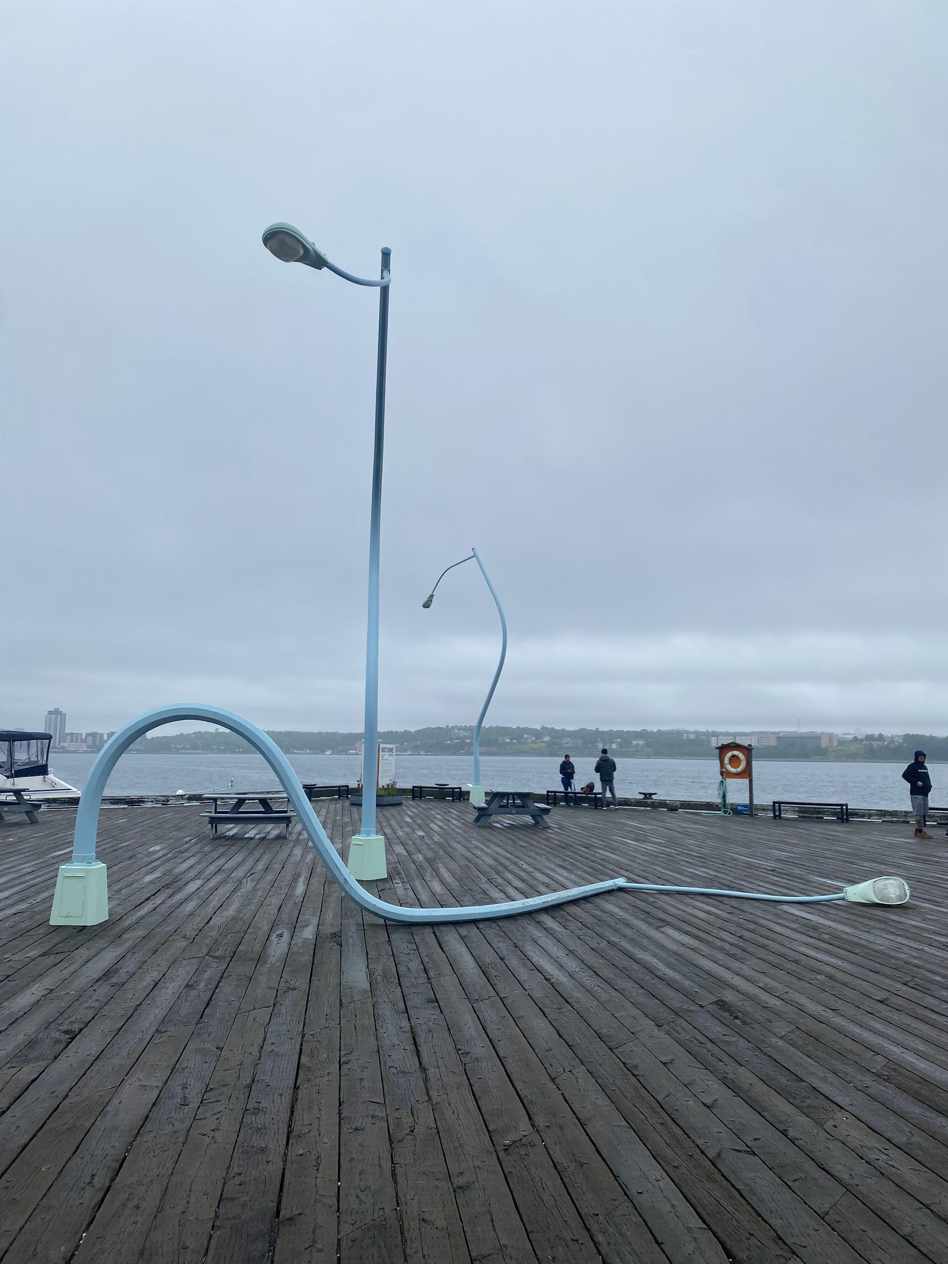 Drunken lamp posts art installation on the boardwalk in Halifax.