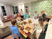 The family gathered to prepare the Welcome Bags for guests!!!