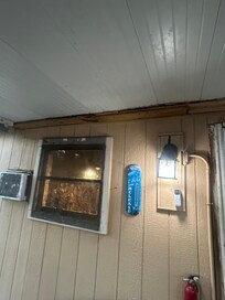 Windows are about to off the frame ,ac unit the same the roof is rotted out