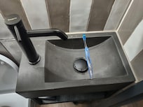 Ridiculously small sink. Toothbrush for scale.