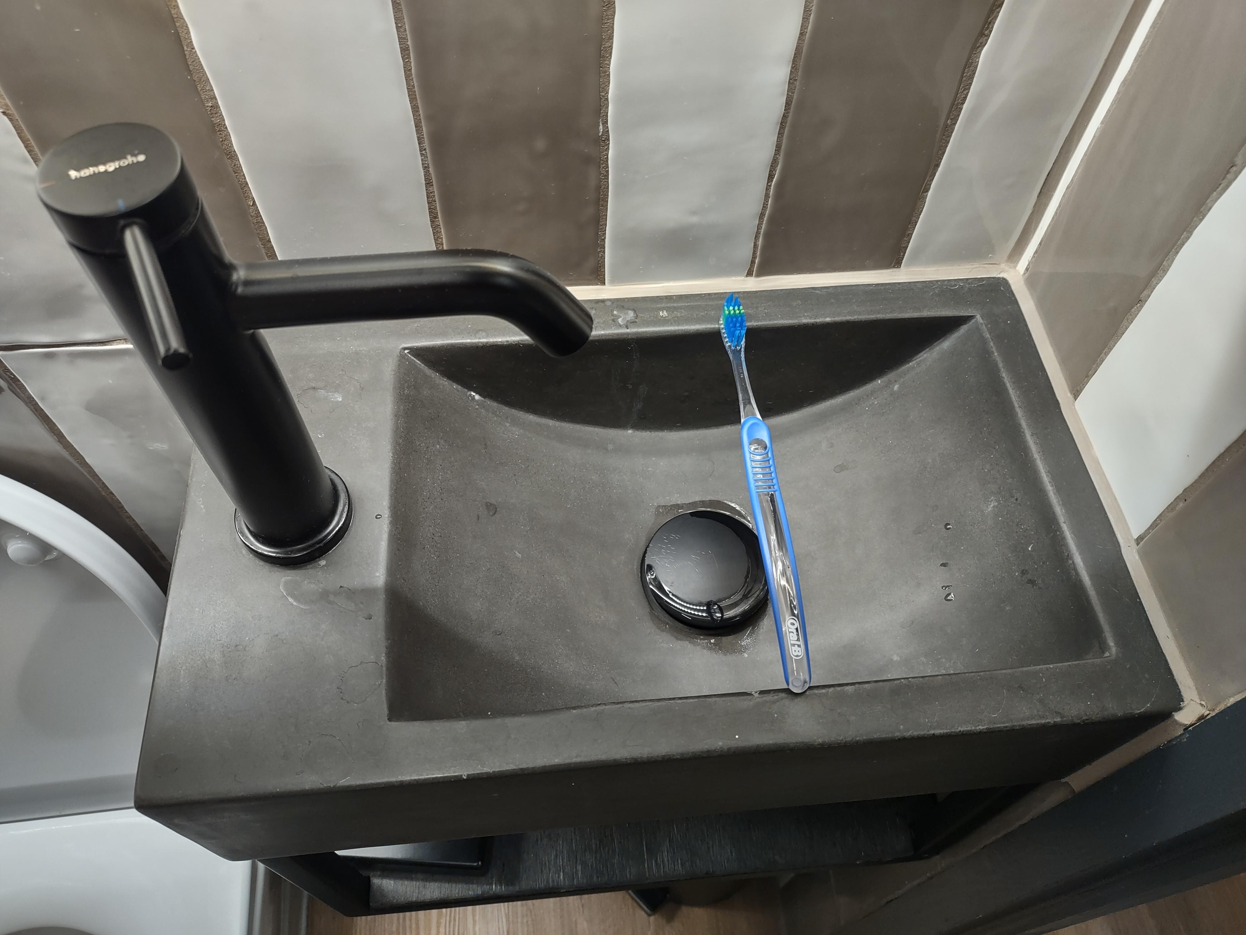 Ridiculously small sink. Toothbrush for scale.  