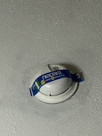 Who knows when it happened, but someone stuck the label from a Filterd Water bottle over the smoke detector. Most likely just to block the annoying red light that keeps blinking.