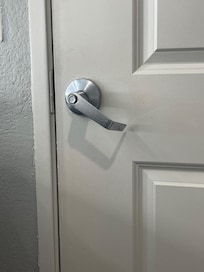 Door handles would not go back center or close properly to restroom