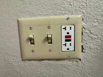 This is just one example of exposed drywall and insilation around the room. Everything was installed haphazardly.