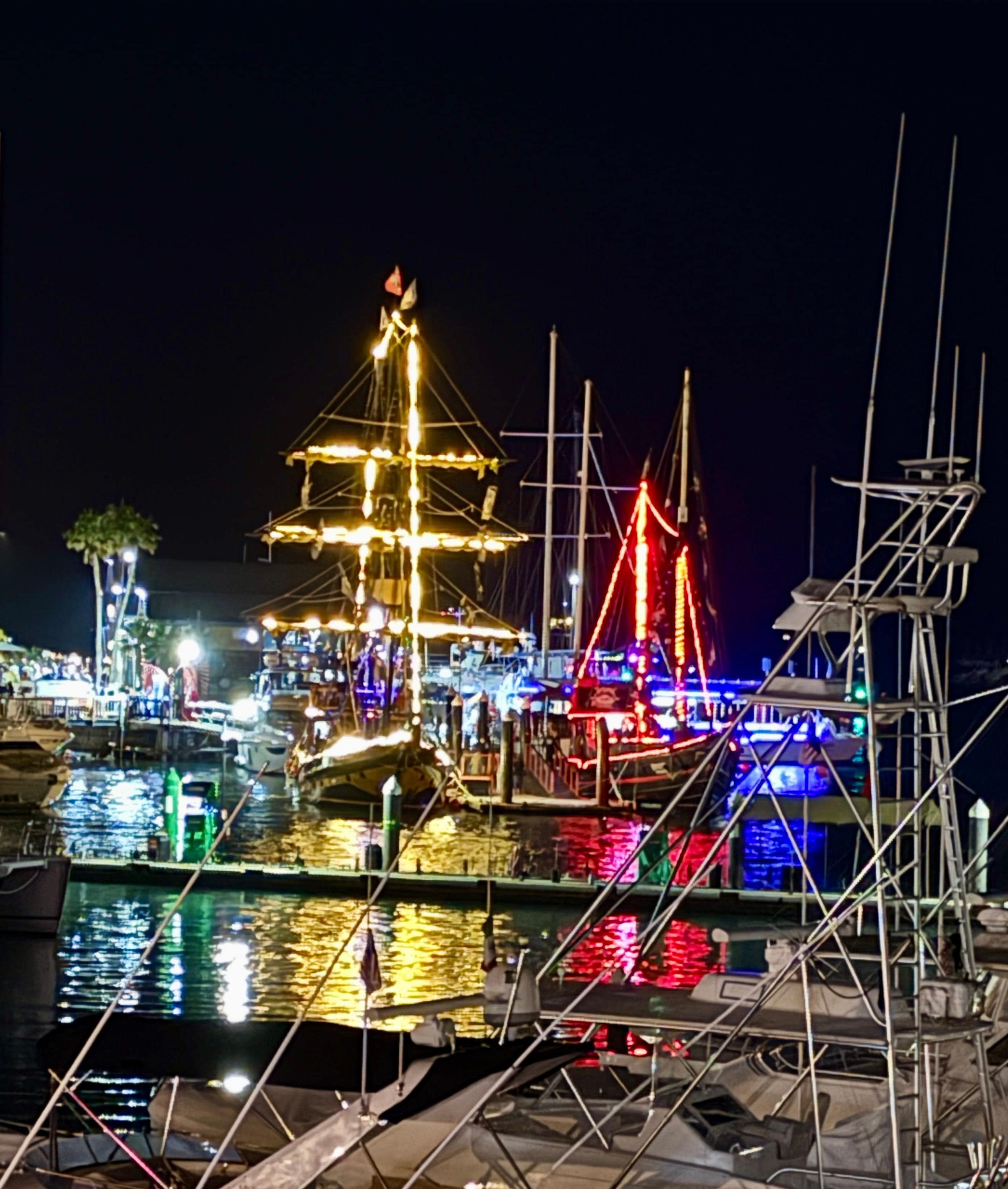 Return of pirate ships after sunset cruise from deck.