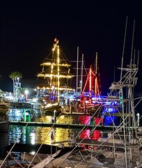 Return of pirate ships after sunset cruise from deck.