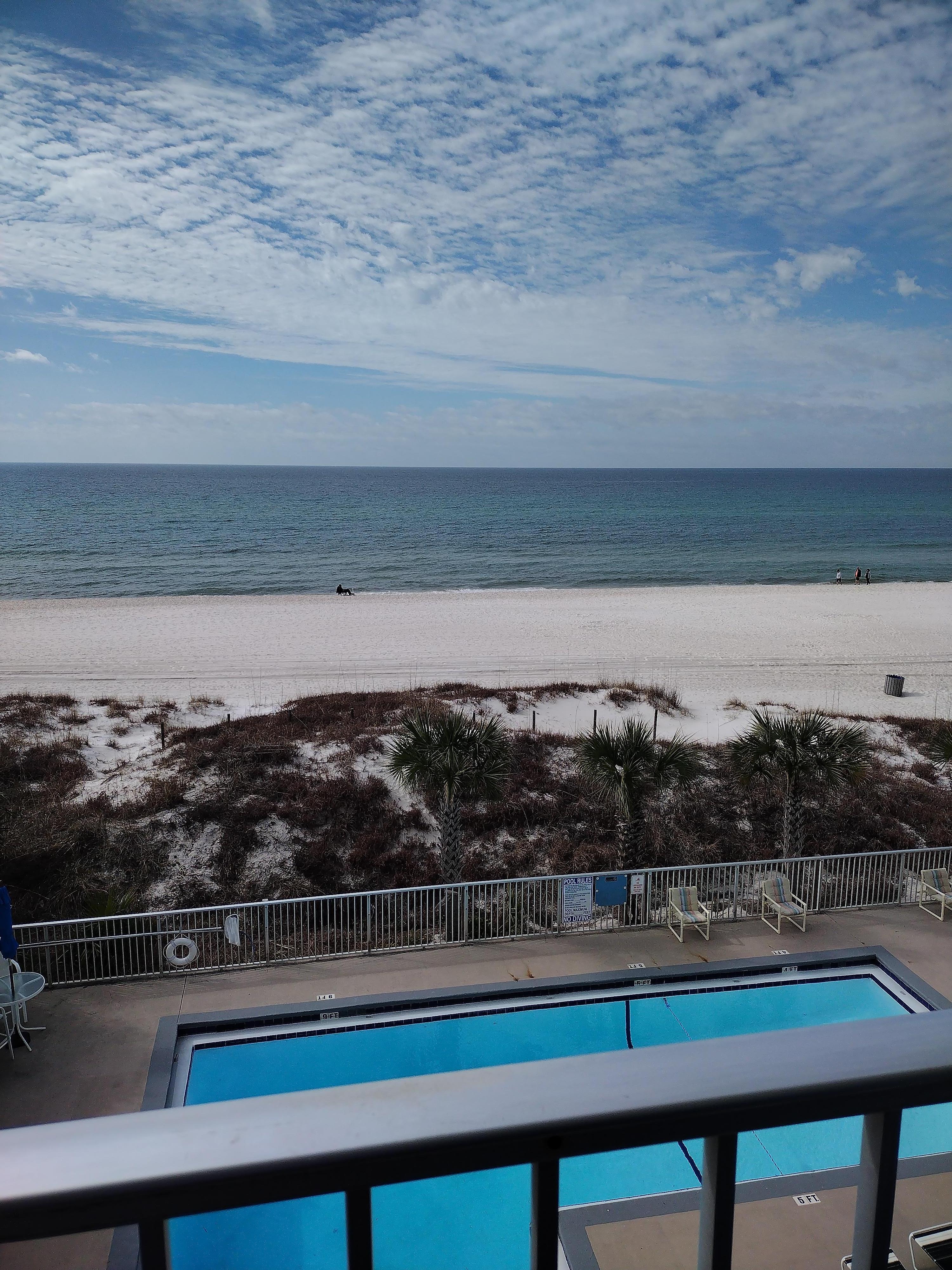 Deck view of beach with calming ocean waves. Loved our stay here and will be back.