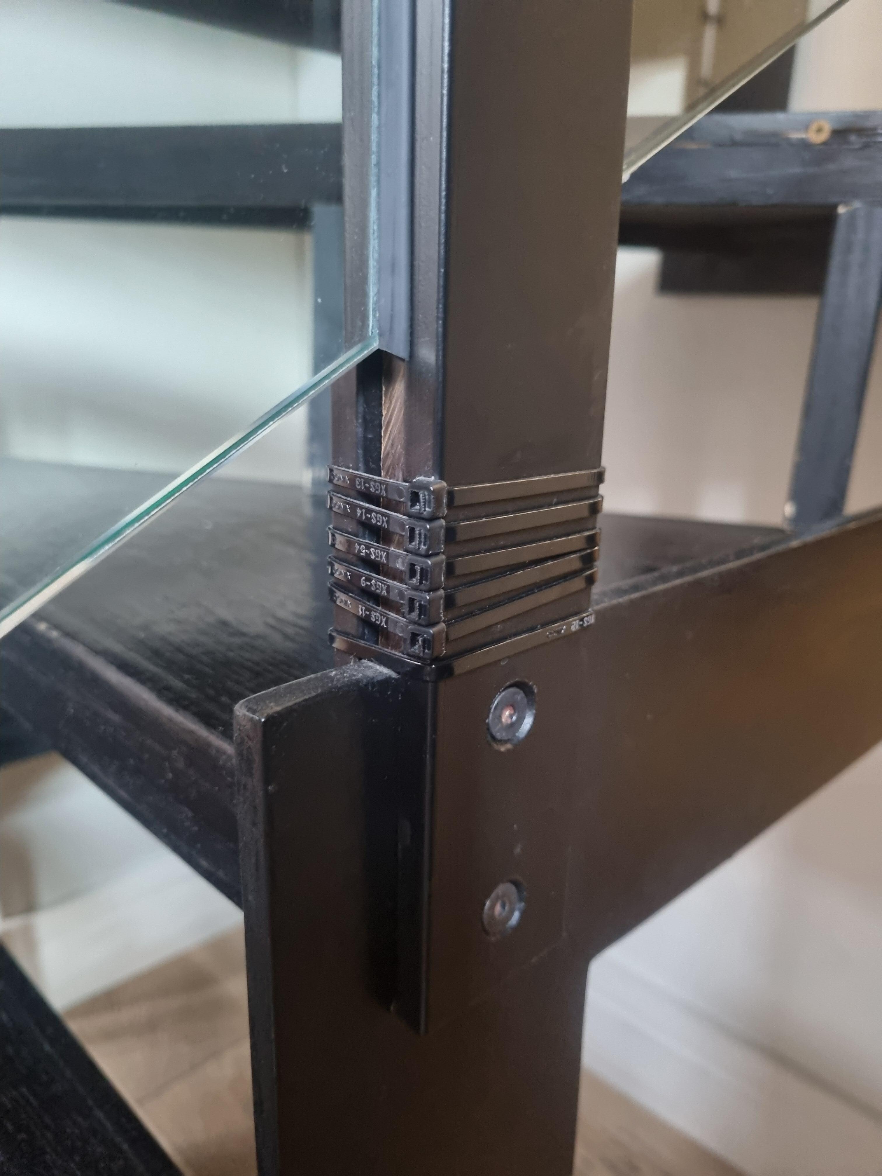 Cable ties holding the banister