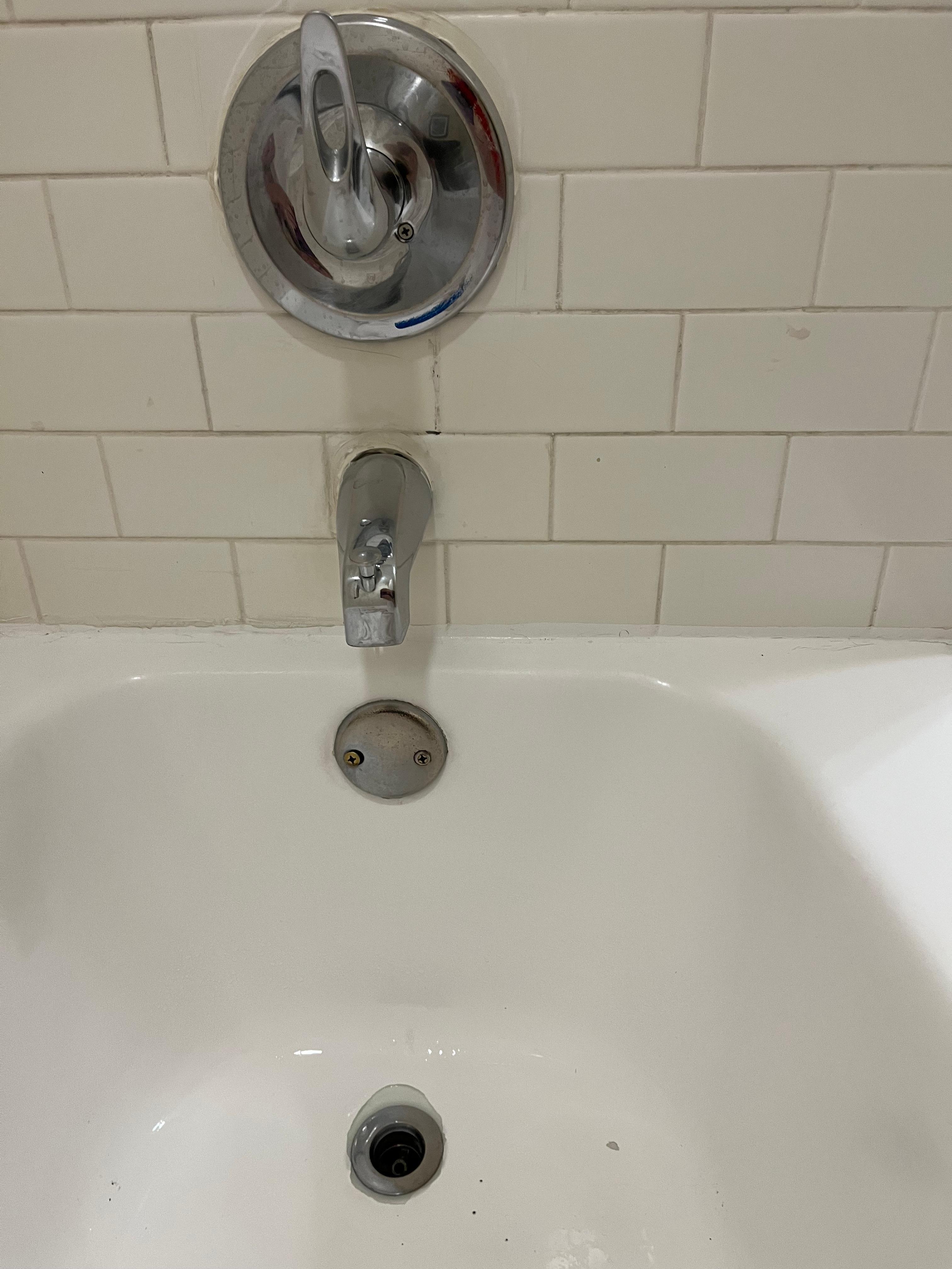 tub dripping, tub drained too slow when  showing * lever coming out of tile.