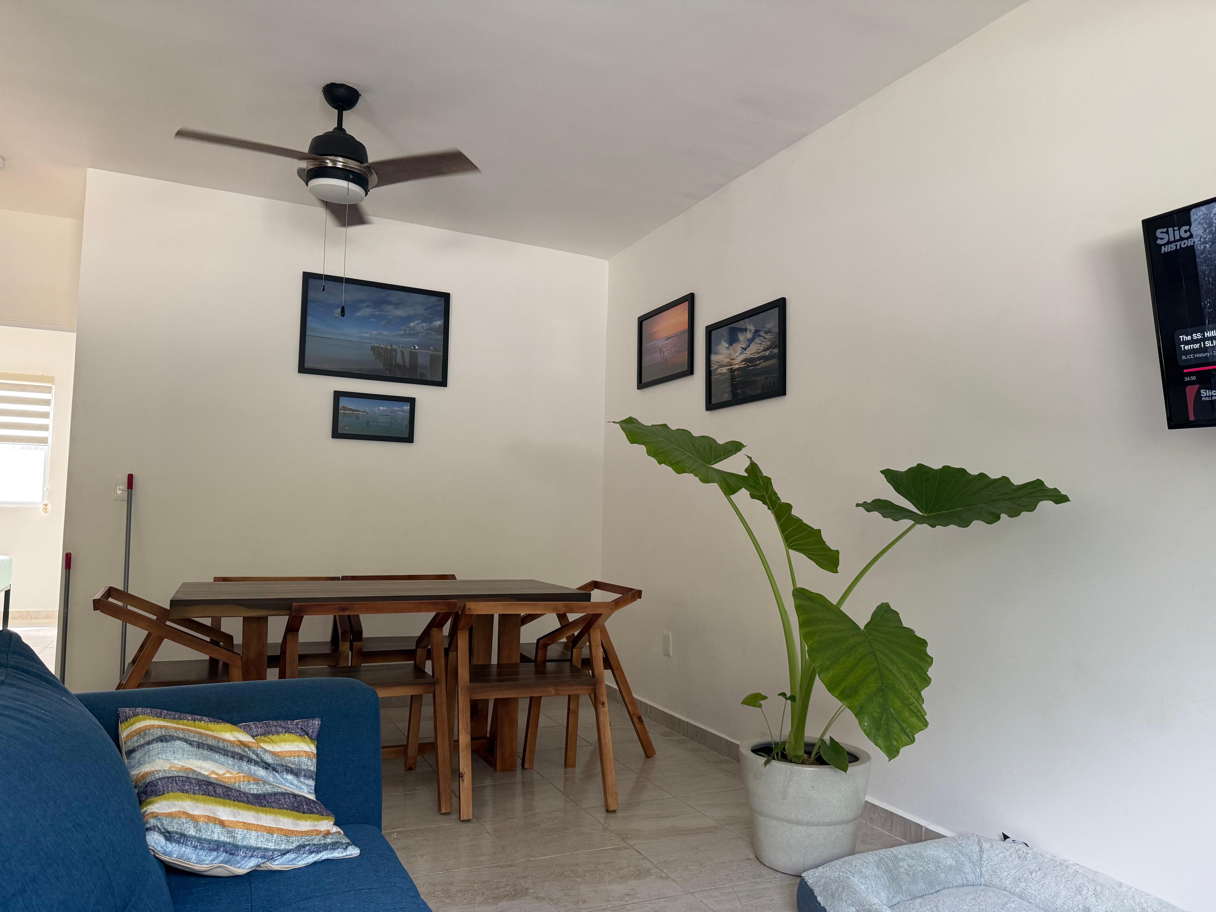 from the living room  facing the dining room with photographs the owner took