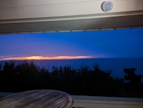 Standing on the balcony.