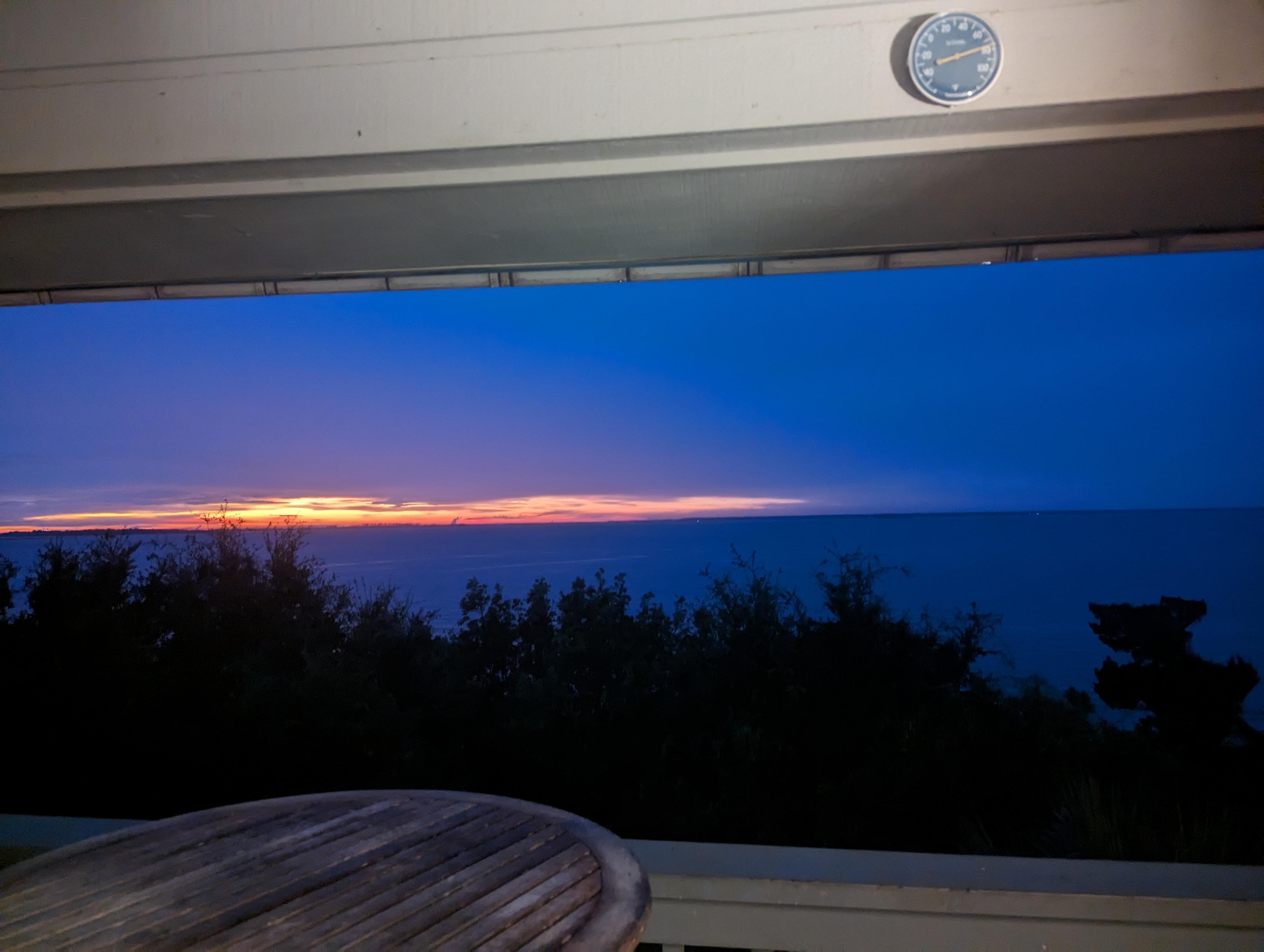 Standing on the balcony. 